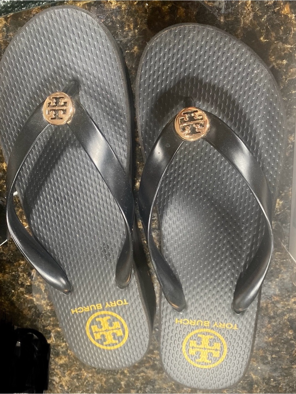 Tory Burch Black Flip Flop Sandals with Gold Logo Medallion